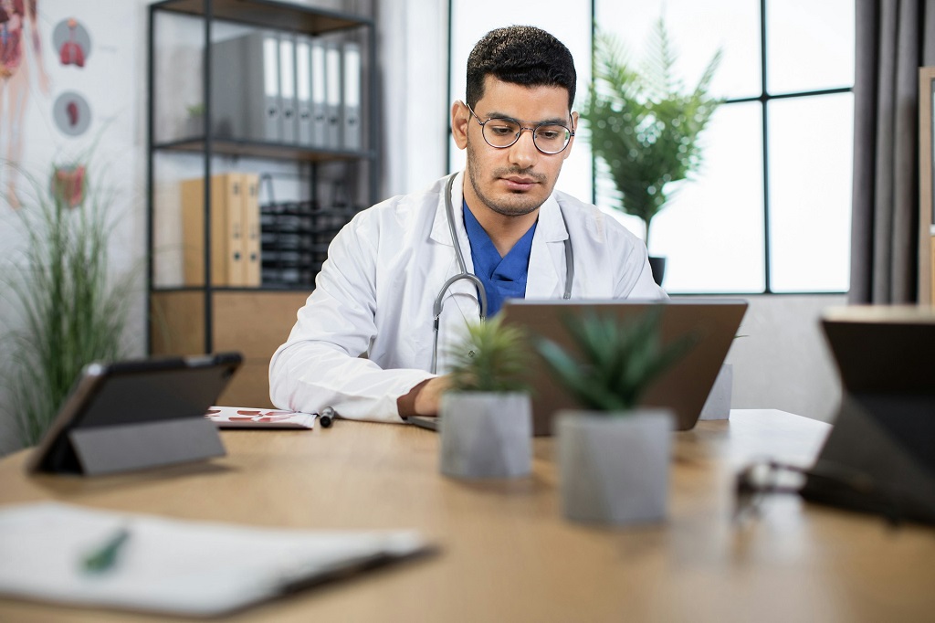 Doctor in front of laptop