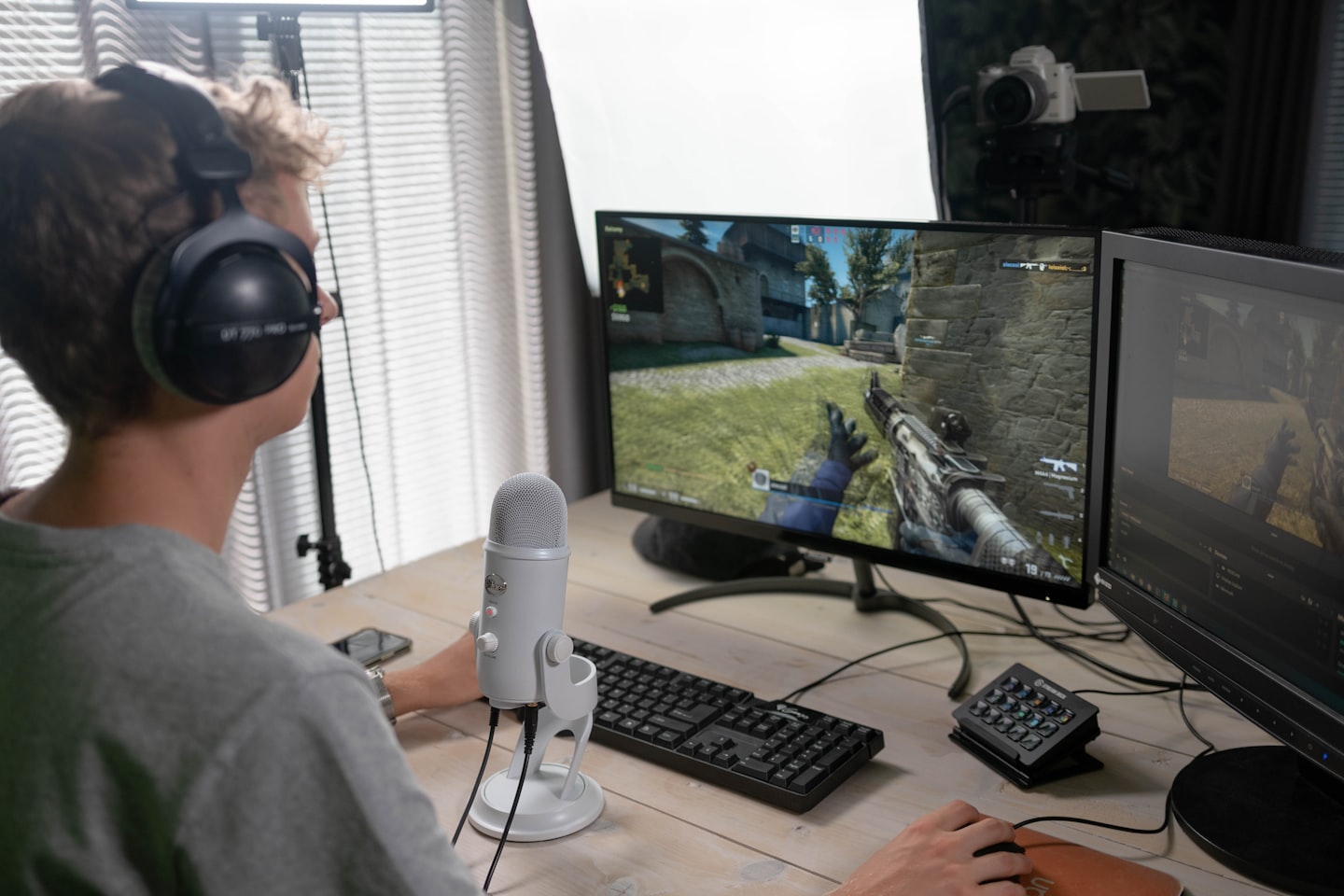 A live streaming setup with a creator on camera and a dashboard-style screen suggesting token tipping.