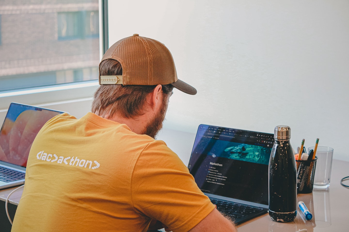 Laptop and documents representing compliance, privacy, and age verification planning for an adult website