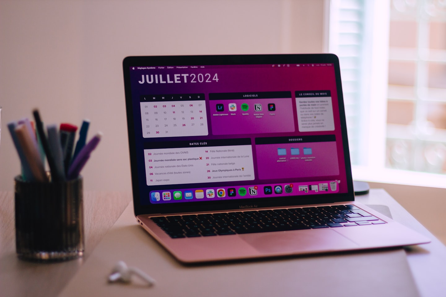 Online creator planning content schedule on laptop for staying busy camming and building repeat audience habits