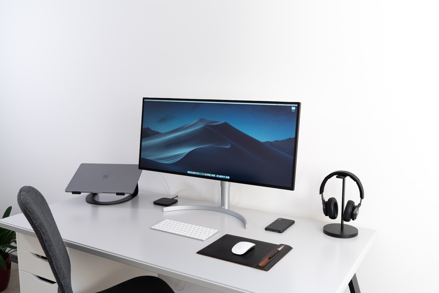 Modern desk setup with monitor and laptop for preparing adult video script hosting and installation