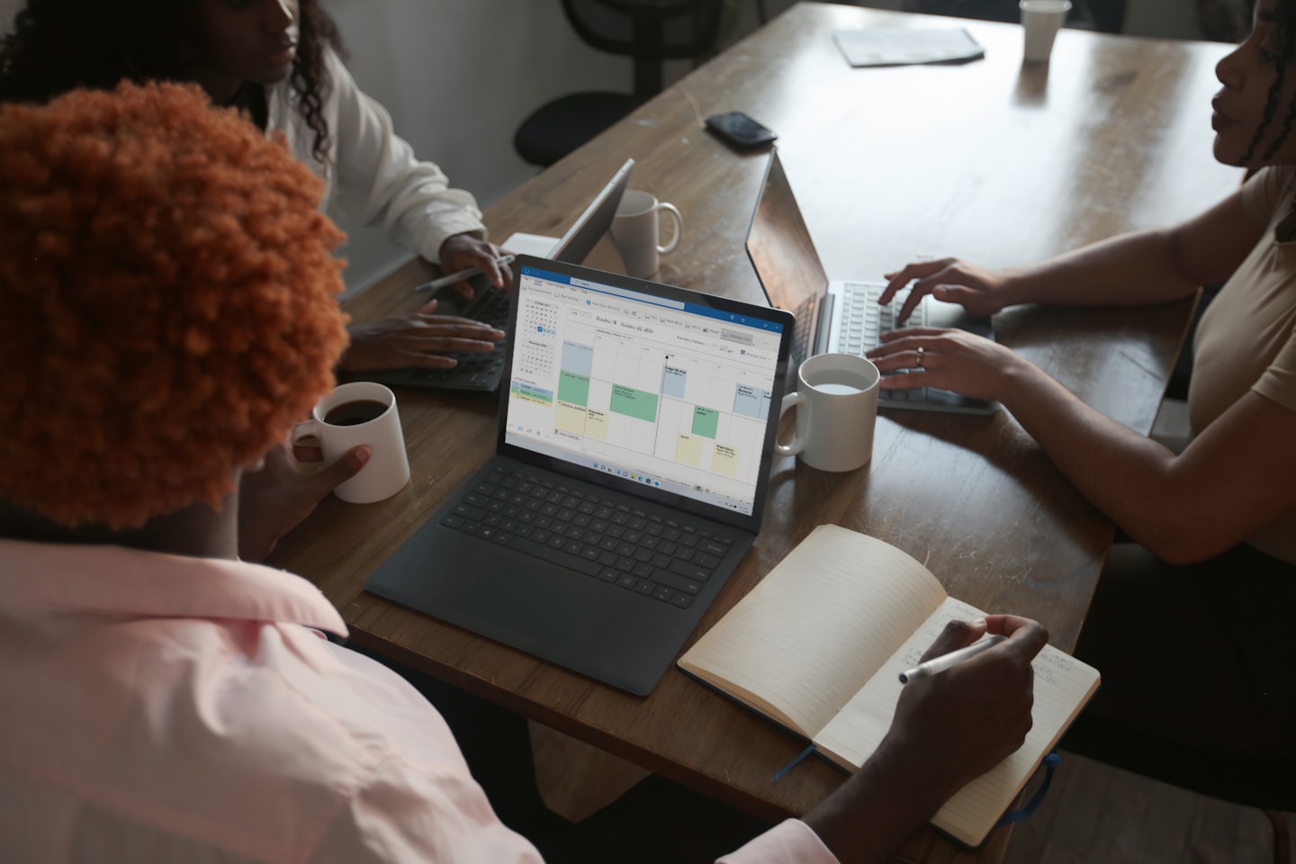 Team reviewing platform dashboard while evaluating an adult turnkey script for launch speed and features