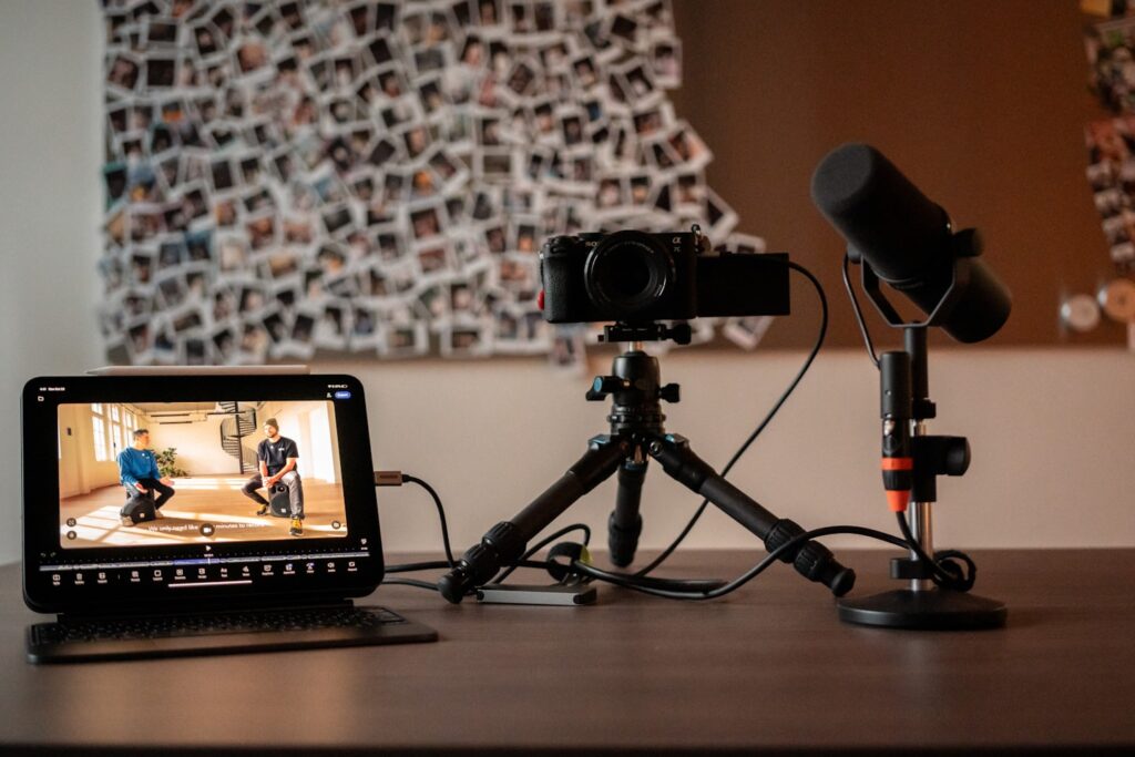 Attractive webcam creator in a polished studio with streaming setup and platform dashboard on a monitor