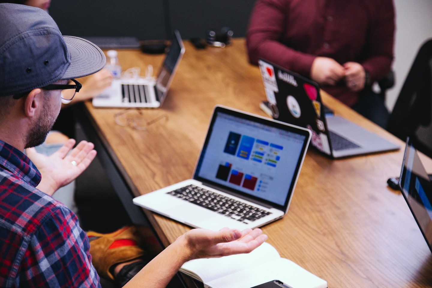 Startup team analyzing video chat API pricing, participant-minute costs, and usage forecasts