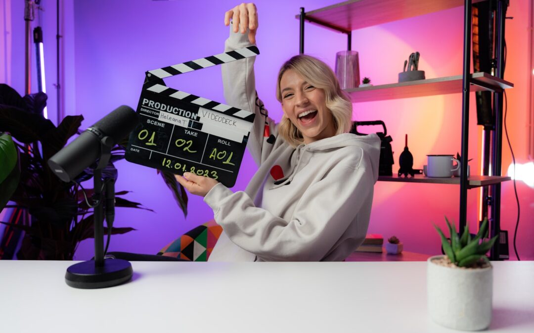 Confident adult content creator working in a home studio with a laptop and ring light.