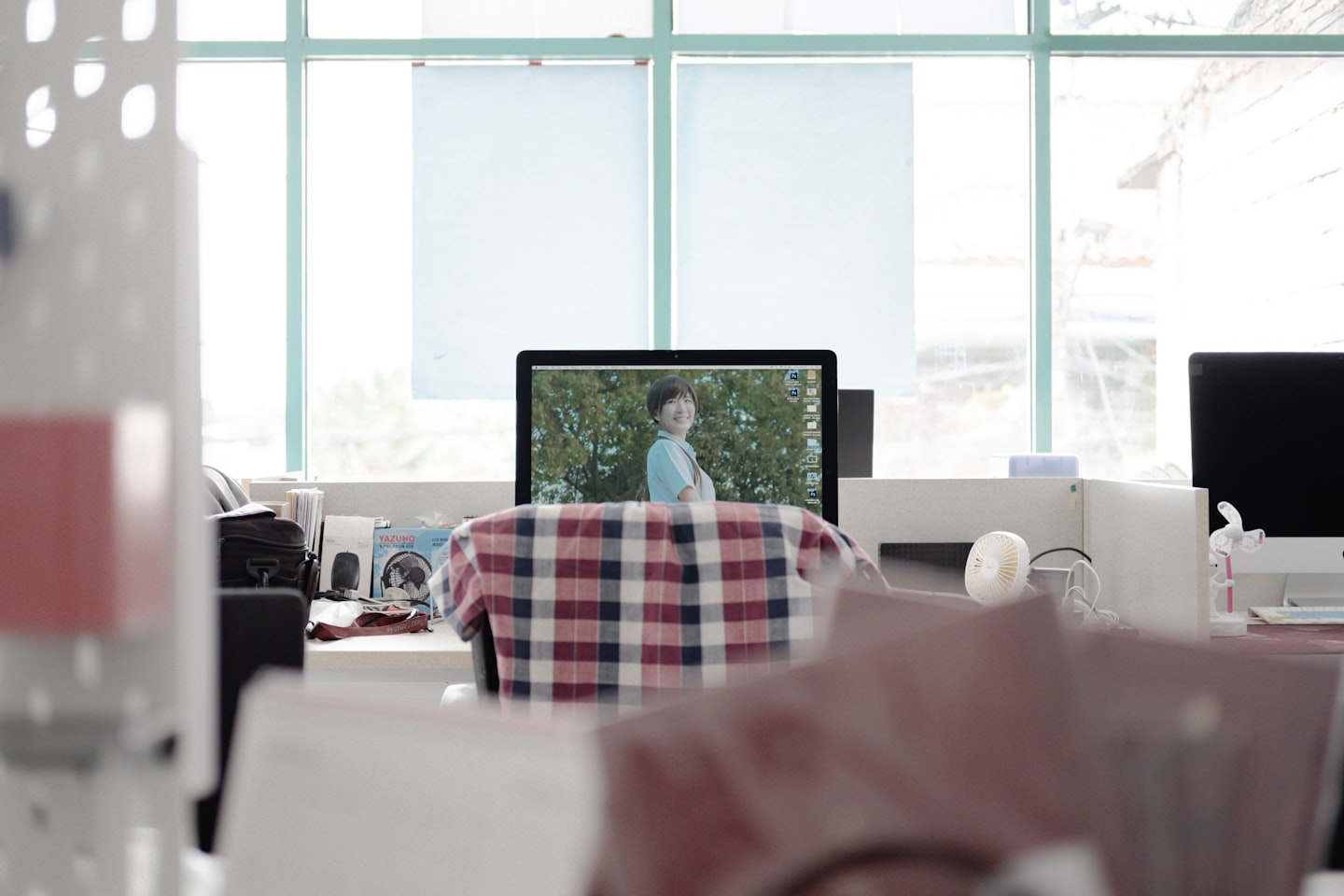 Webcam and mirrorless camera gear on a desk for comparing camming setup options