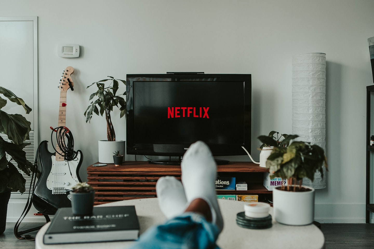 A smart TV displaying a streaming platform interface, representing multi-device delivery for a Netflix-like service.
