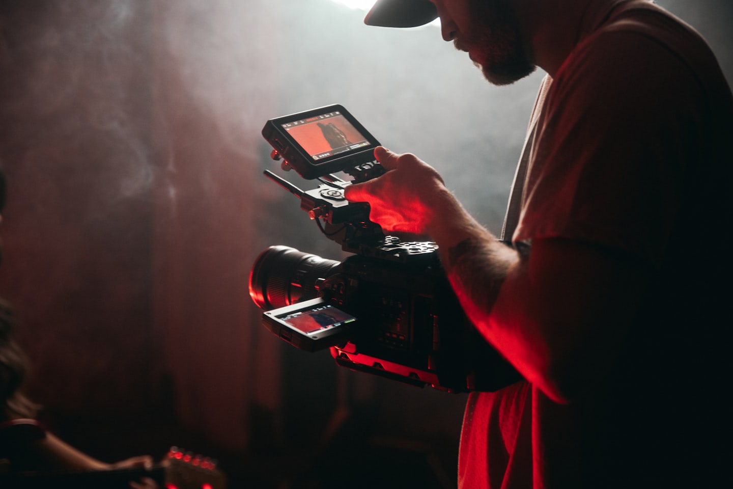 A confident content creator in a bright home studio considering a switch to a better-fit streaming platform