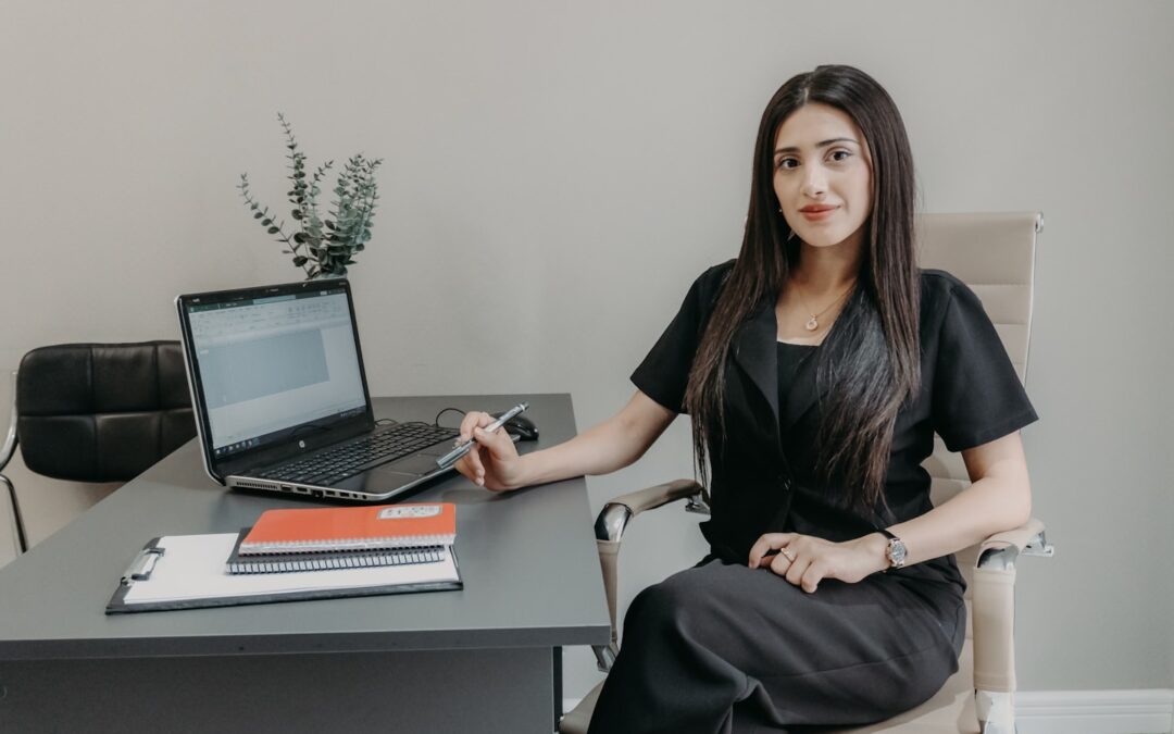 A professional reviewing a video call workflow on a laptop, representing the best video conferencing software for consultations and remote sessions.