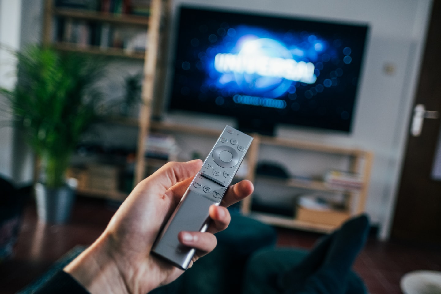 Viewer watching streaming content on a smart TV in a modern living room