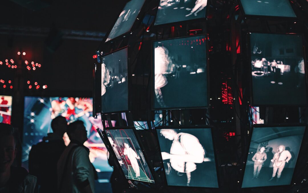OTT platform operator reviewing a video security dashboard on a modern monitor