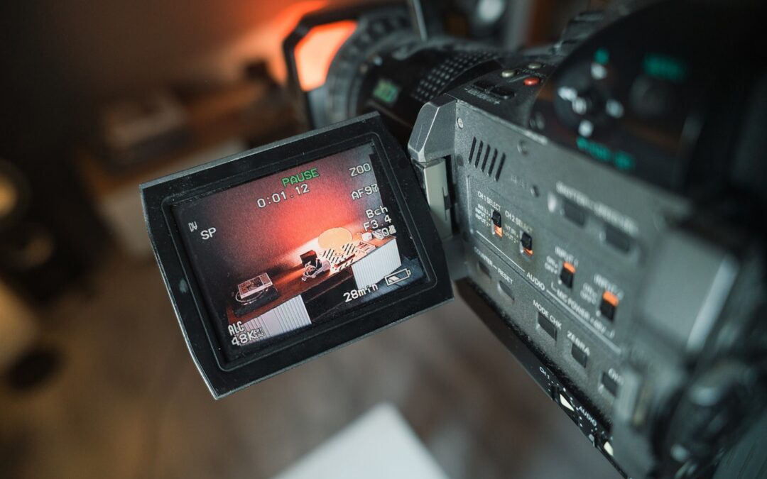 Founder reviewing a video streaming dashboard and platform architecture on a large monitor