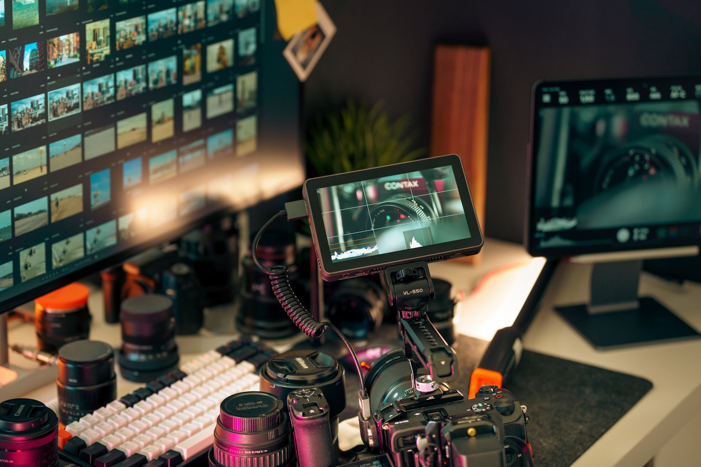 Product team workspace with a monitor displaying streaming platform components and workflows