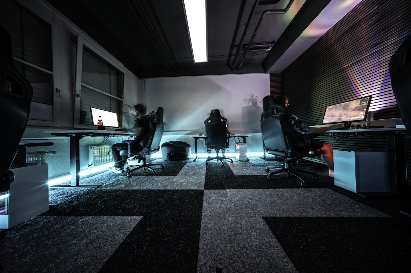 a group of people sitting around a table in a room