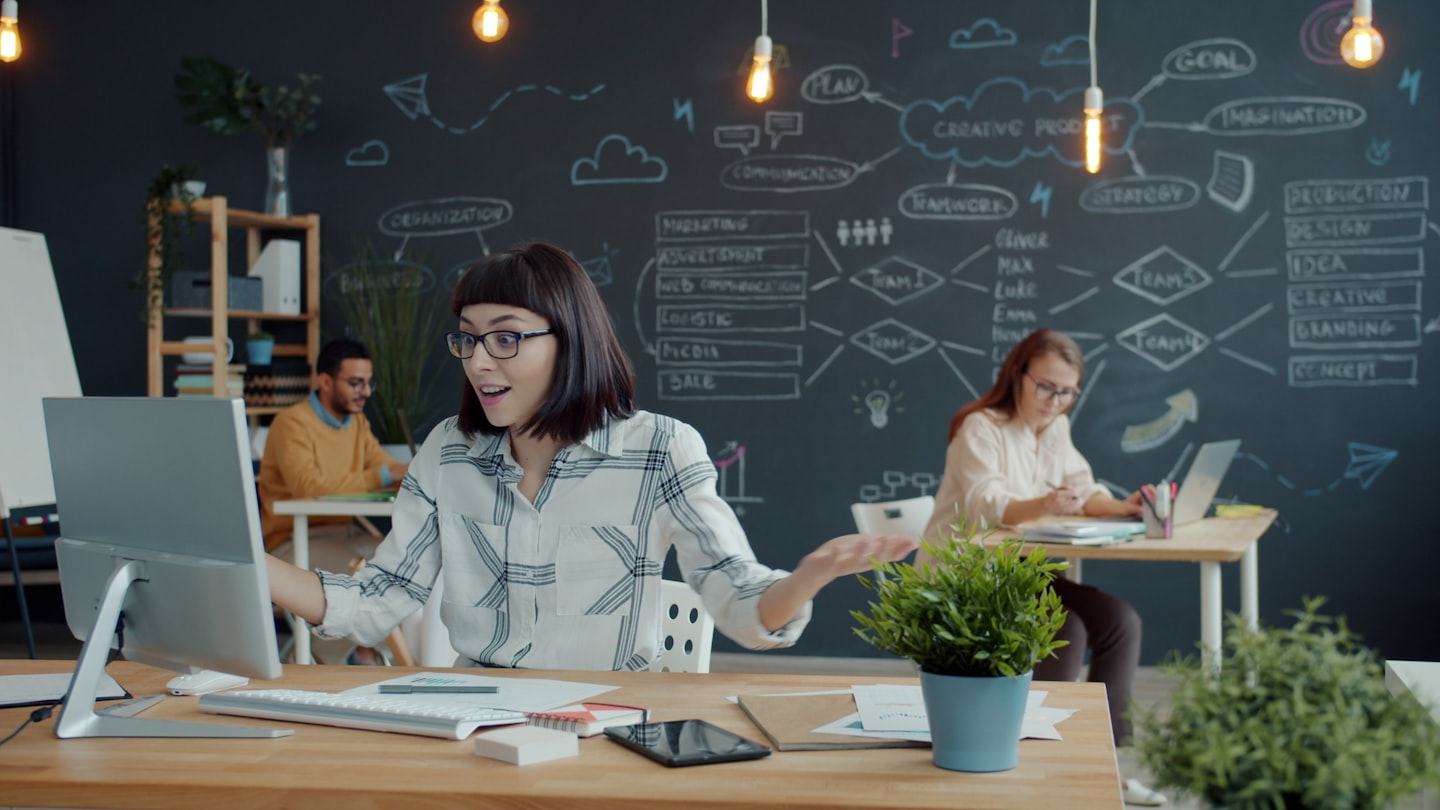 People working in a modern office with chalk drawings