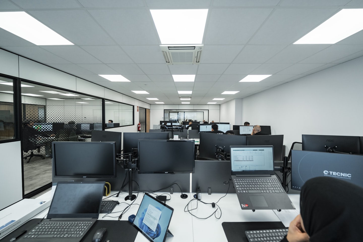 Office space filled with computers and people