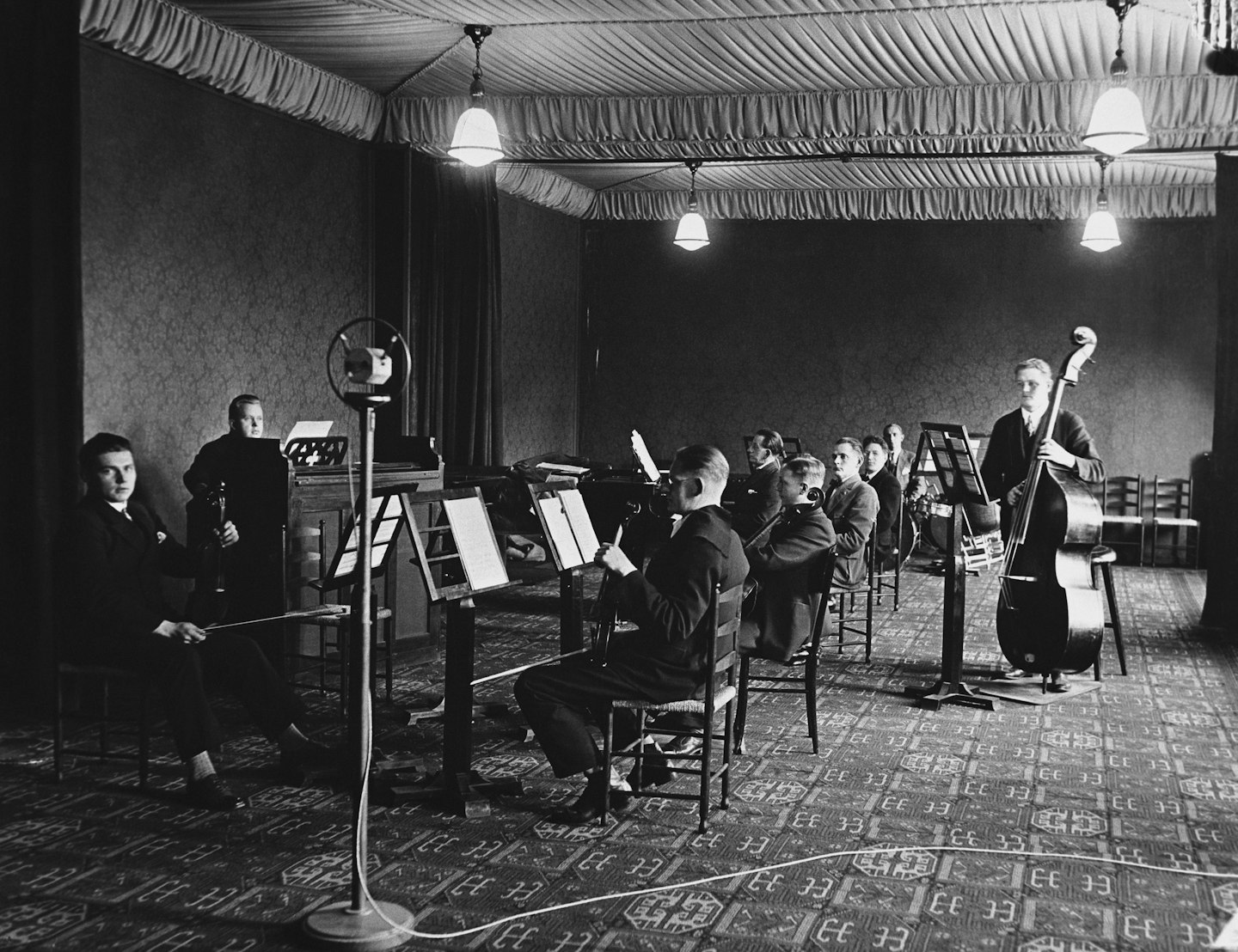 a black and white photo of a band in a room